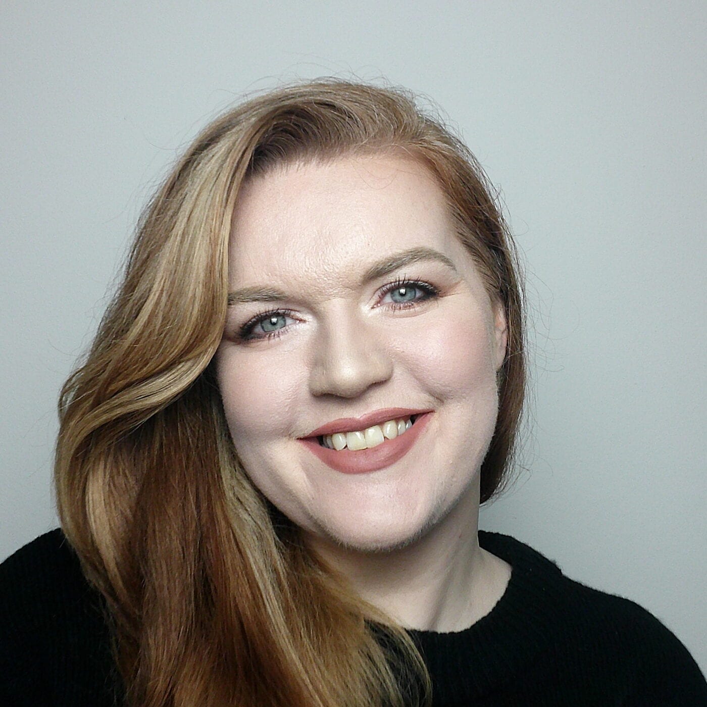 Rose Butcher, AI visibility specialist, smiling to camera