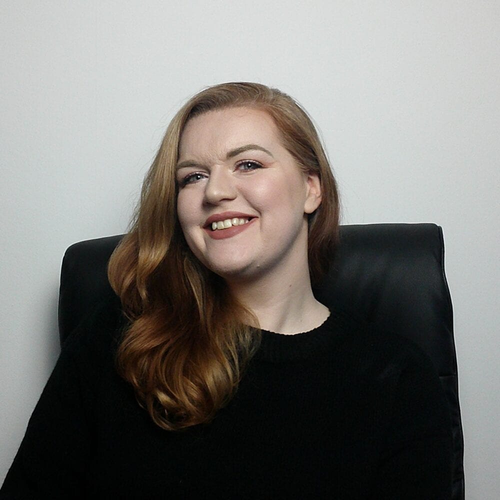 Rose Butcher, AI visibility specialist, smiling to camera